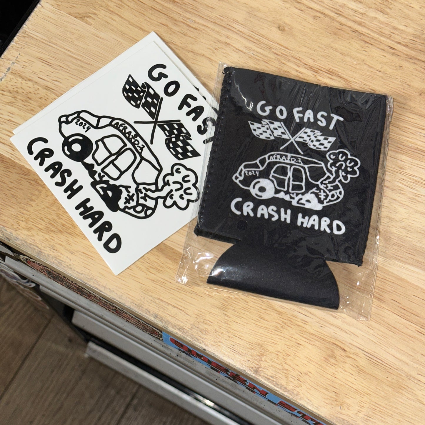 GO FAST . CRASH HARD DRINK KOOZIE - BLACK